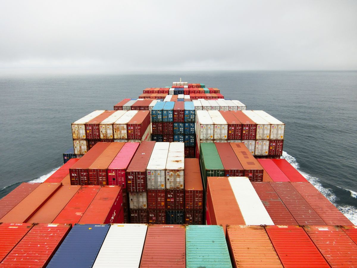 View from a cargo ship containers in the ocean by Rinson Chory