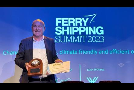Glenn Carr, Director of Commercial Business Units with Iarnród Éireann - Port Authority for Rosslare Europort, smiles as he accepts the award Ferry Port of the Year at European